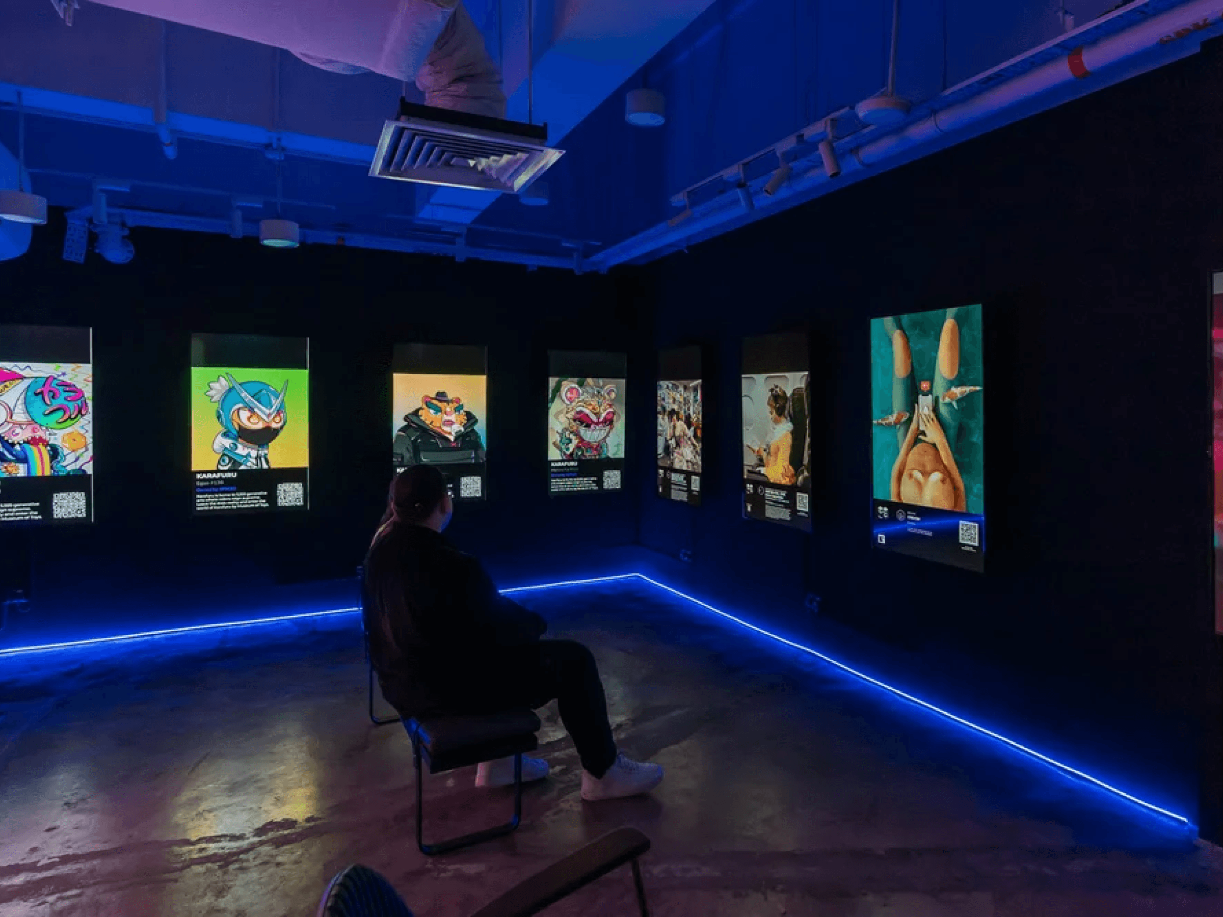 A guest viewing an immersive digital-art installation